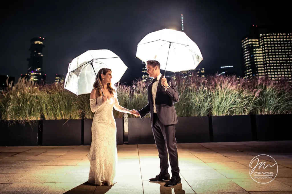 Night photoshoot using wedding umbrellas on the rooftop of Tribeca Rooftop. A Tribeca Rooftop Wedding by Top NYC Wedding Photographer Josh Wong Photography