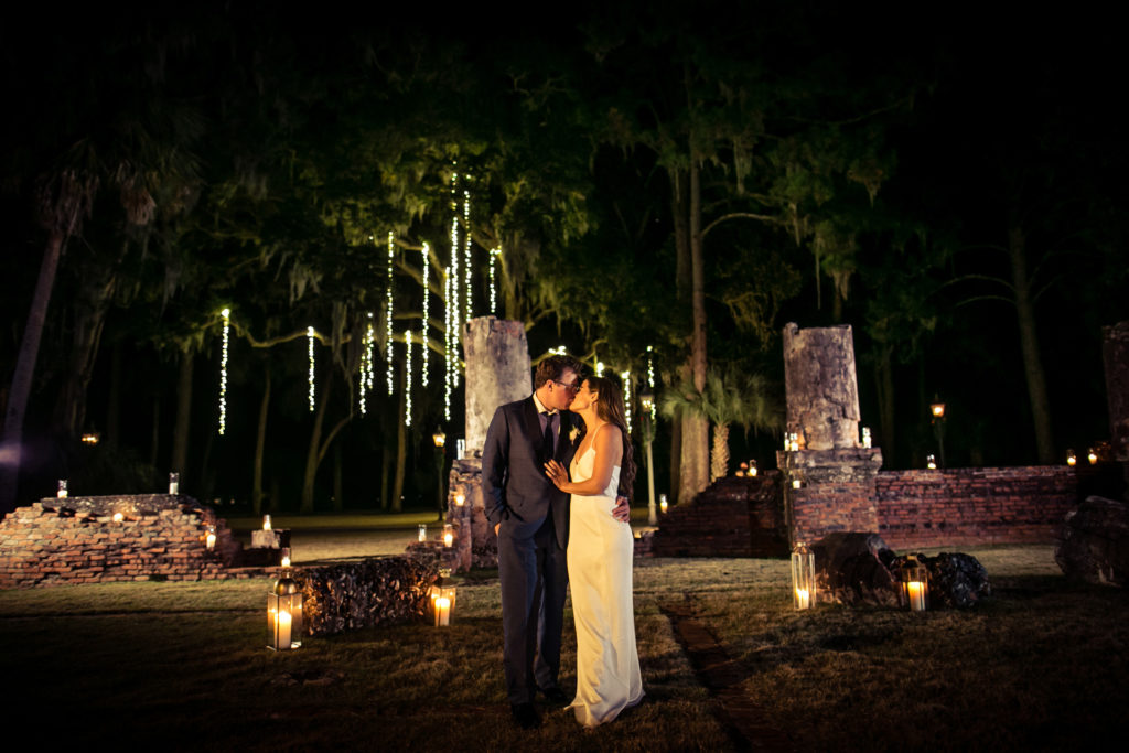A kiss in the evening ending the night under the Spanish moss trees lined with lit stingers. 