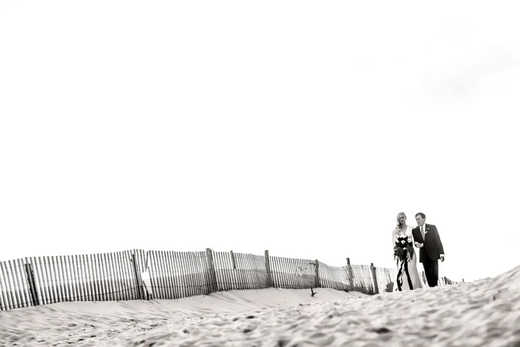 Father of the bride walks his daughter down the aisle.