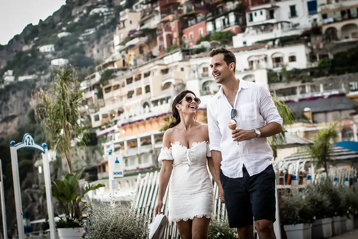 The couple stroll down Via del Brigantino with a gelato from La Gelateria della Buca di Bacco
